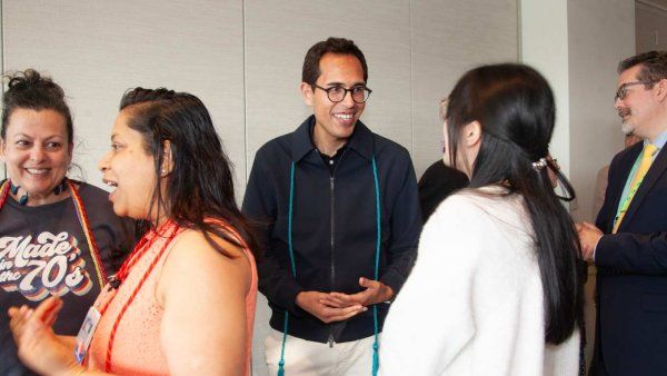 group of diversity graduation attendees networking