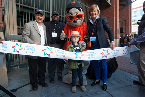From left, San Francisco Mayor Ed Lee, Chevron Vice President of Human Resources Joe Laymon, Giants mascot Lou Seal and UCSF Chancellor Susan Desmond-Hellmann pose for a photo with 4-year-old Dashiell Thompson for the ceremonial ribbon-cutting to open this year's Bay Area Science Festival at AT&T Park.