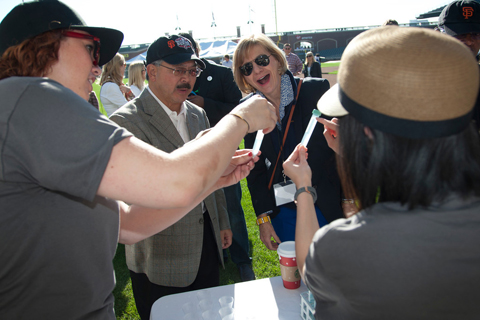 Mayor Ed Lee and UCSF Chancellor Susan Desmond-Hellmann visit one of the booths that allows people to swab their own DNA and view it through a microscope.