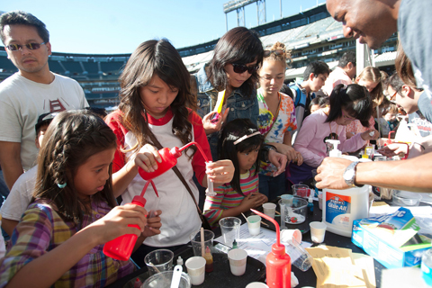 Angel Saldidos, 7, far left, and Jade Pascual, 14, second from left, make their own slime.