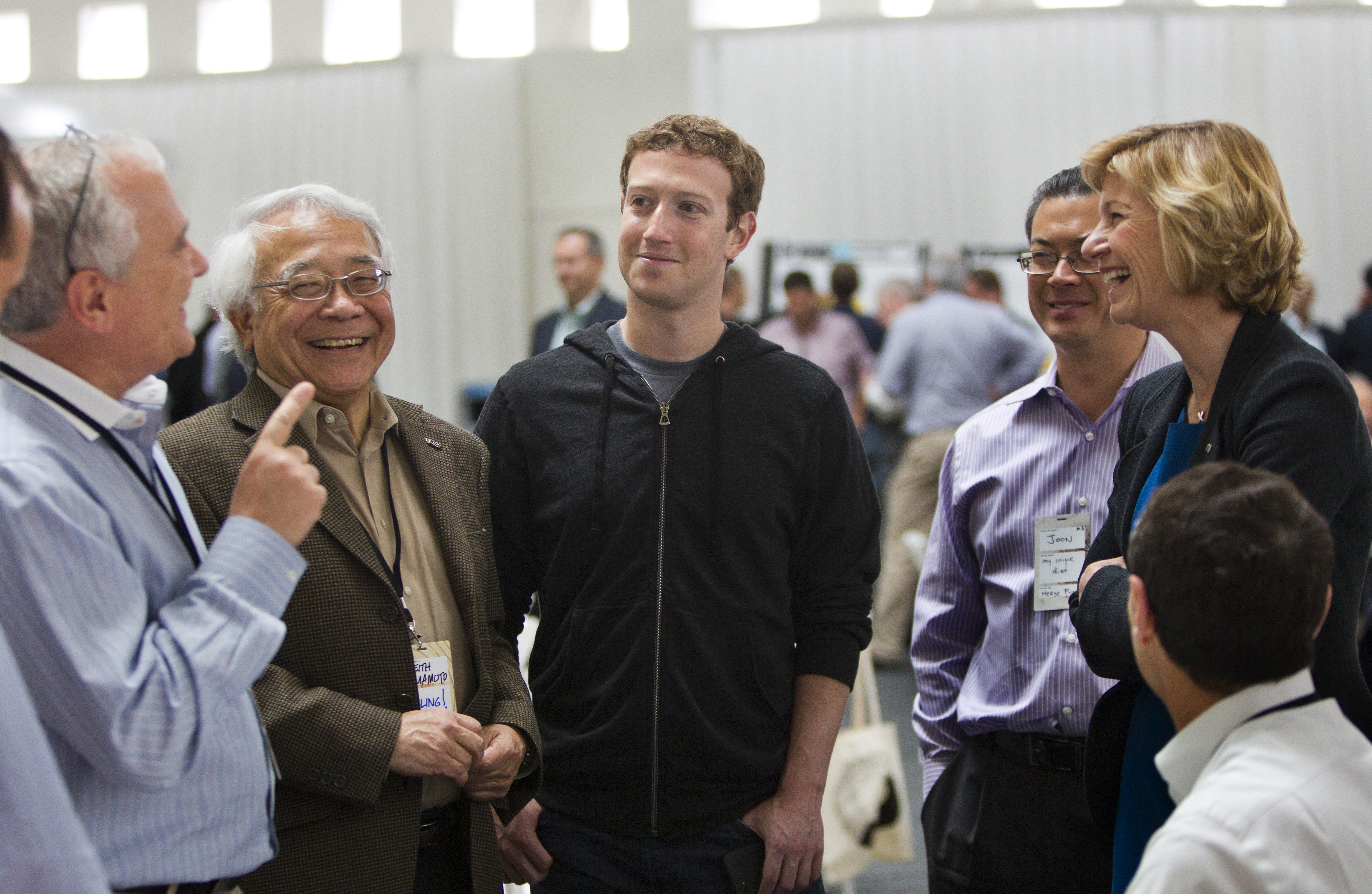 Mark Zuckerberg, center, CEO of Facebook, spent about an hour at the summit learning about the proposals in precision medicine that teams presented.