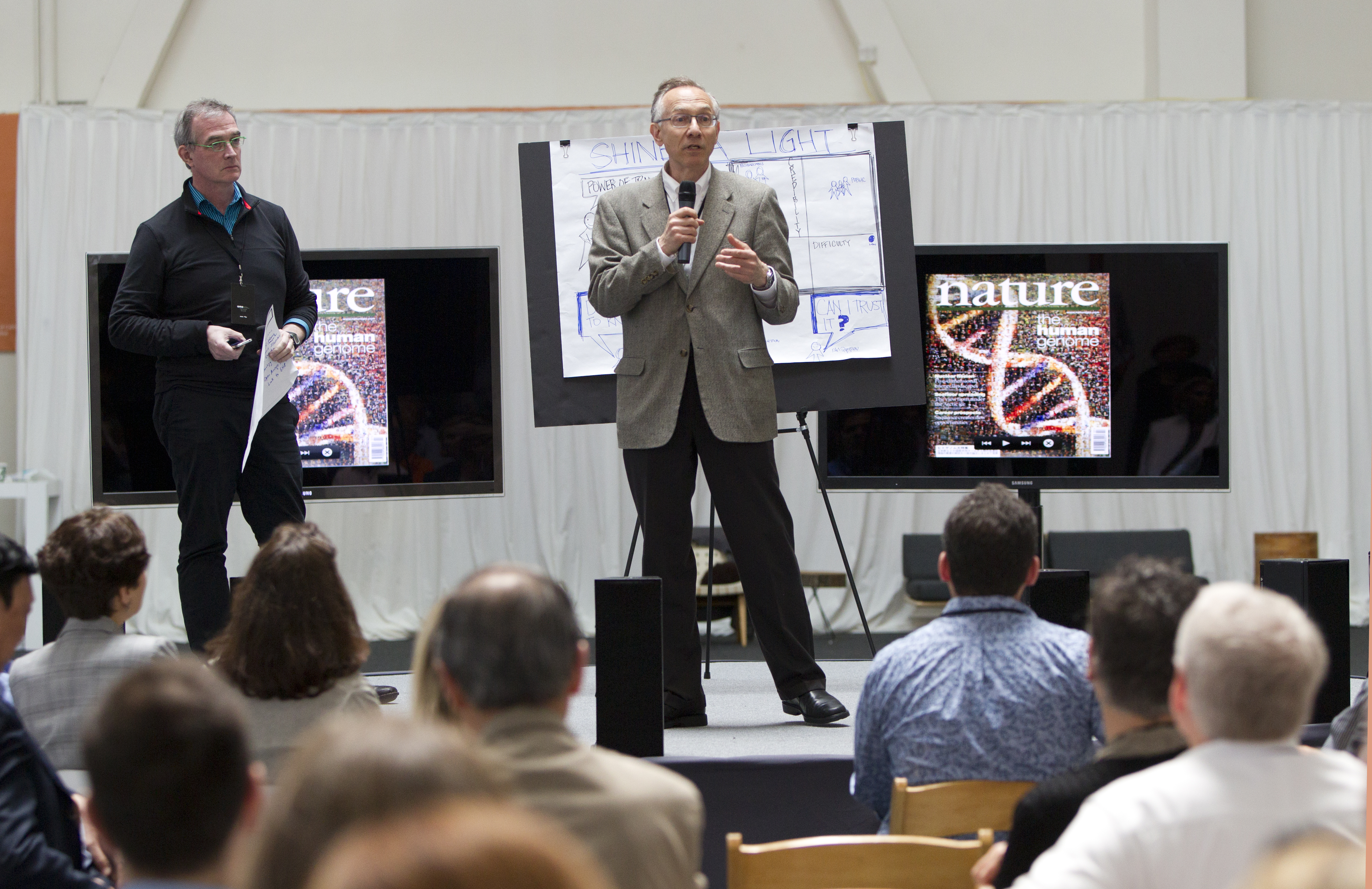 Harvey Fineberg, center, president of the Institute of Medicine at the National Academy of Sciences, presents his team's idea at the closing quick-pitch session on May 3.