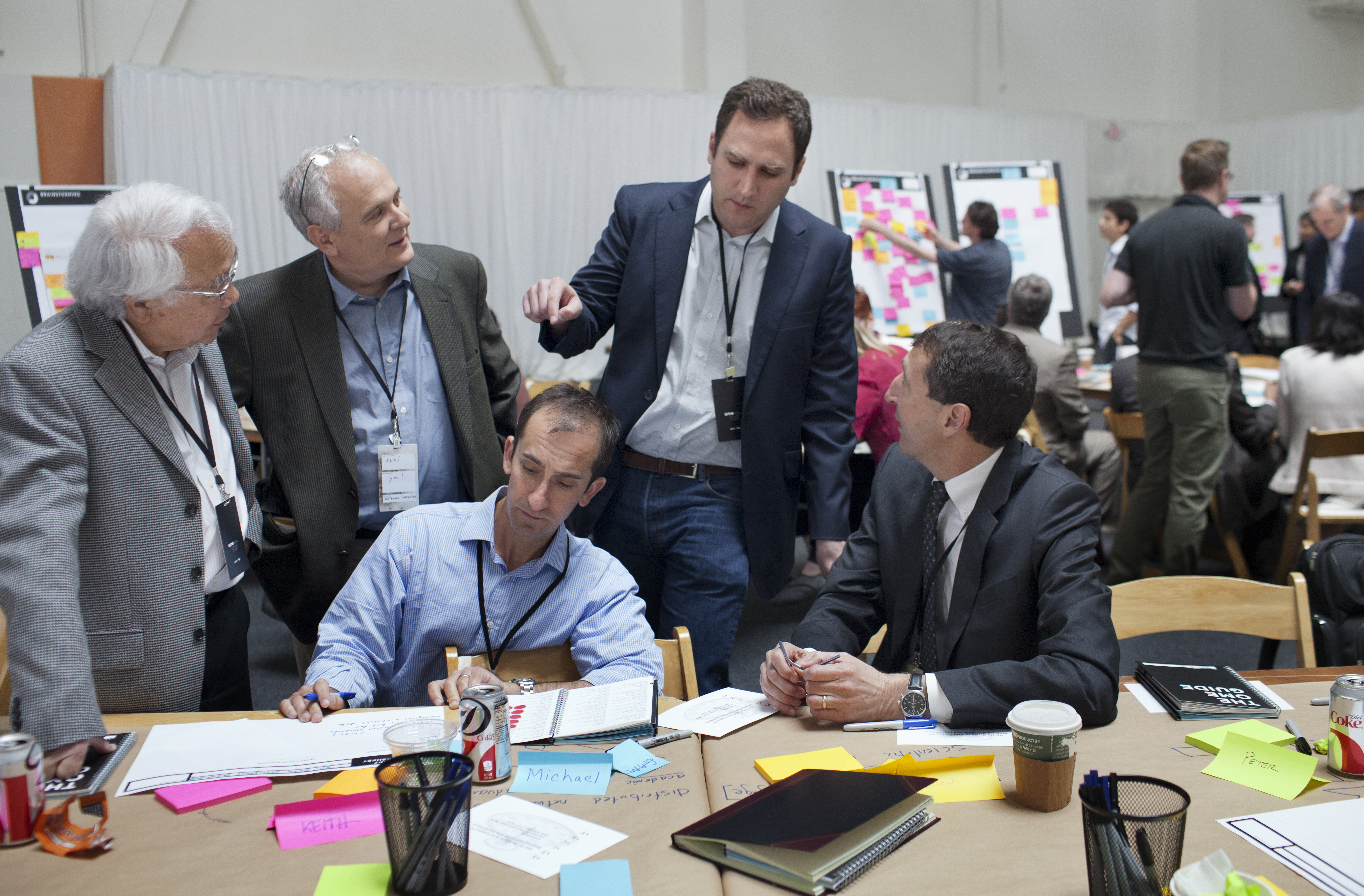 Keith Yamamoto, left, vice chancellor for research at UCSF, talks with team members, including UCSF's Michael Fischbach, a scientist who uses a combination of genomics and chemistry to study microbes.