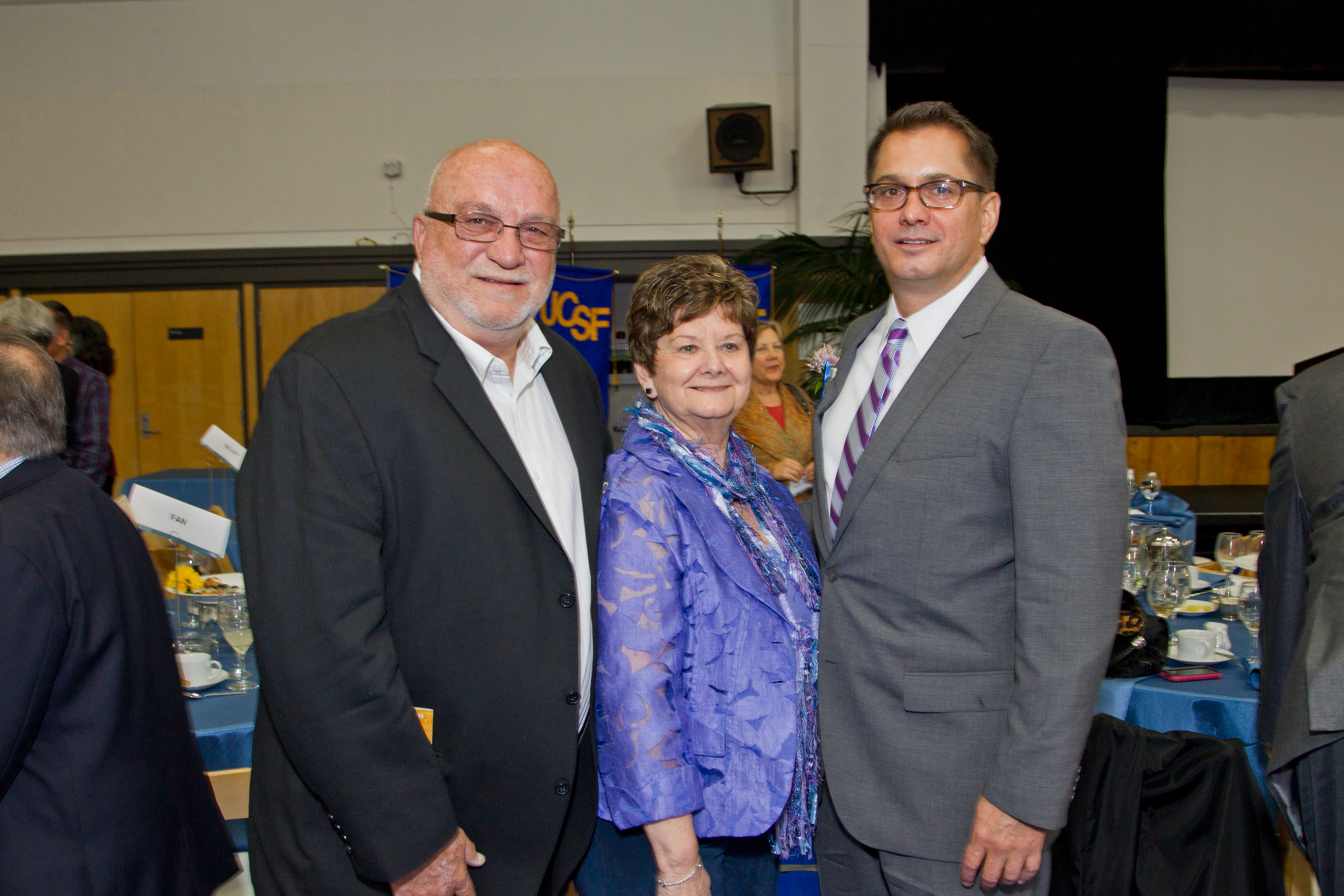 Jon Giacomi, right, who also received an exceptional university management award, stands with his proud parents, Patrick and Shirl Giacomi, at the luncheon.