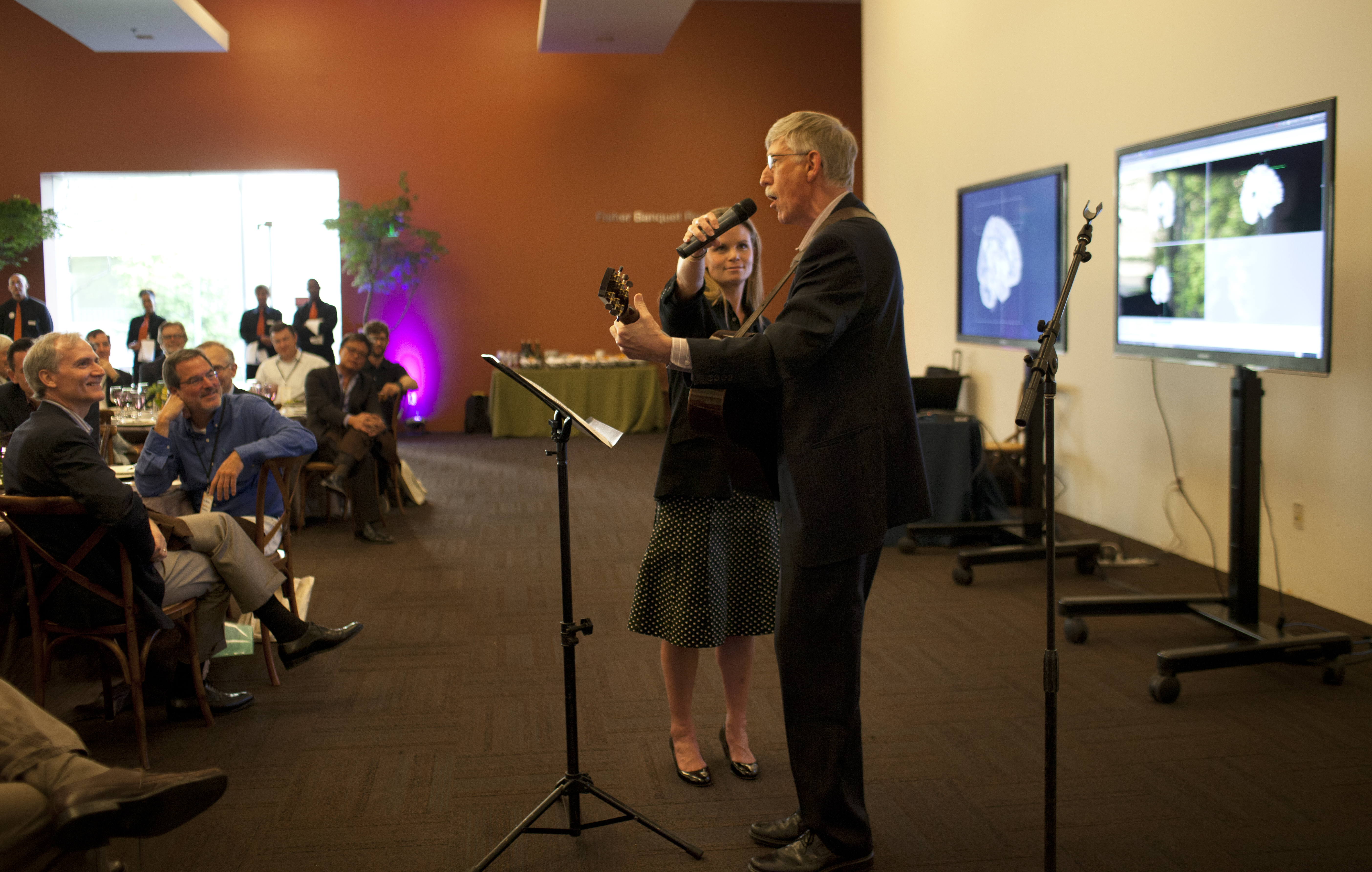 Francis Collins, director of the National Institutes of Health, sings a song about precision medicine at the dinner on May 2.