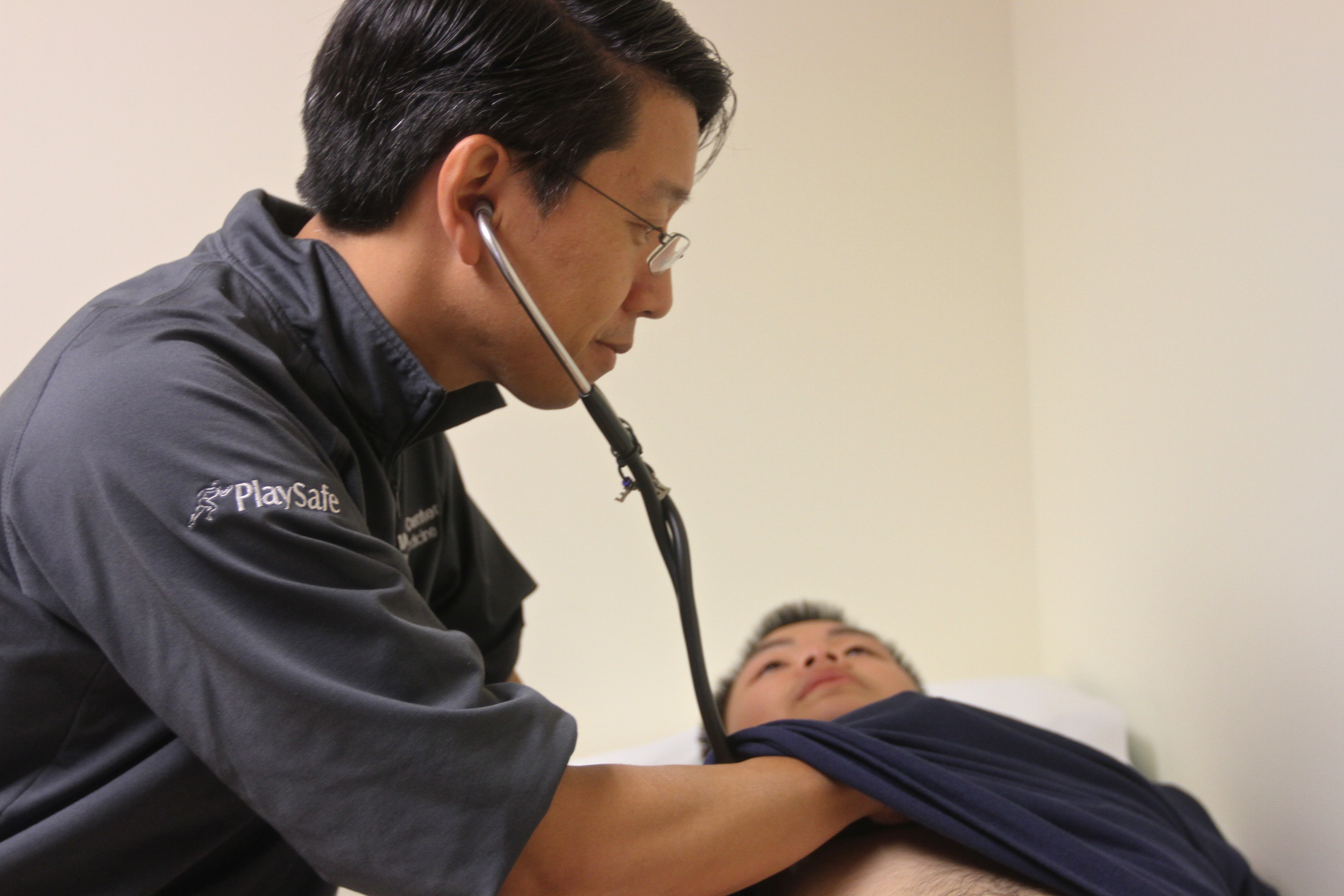 A doctor then listens to the patient's heart for any irregularities.