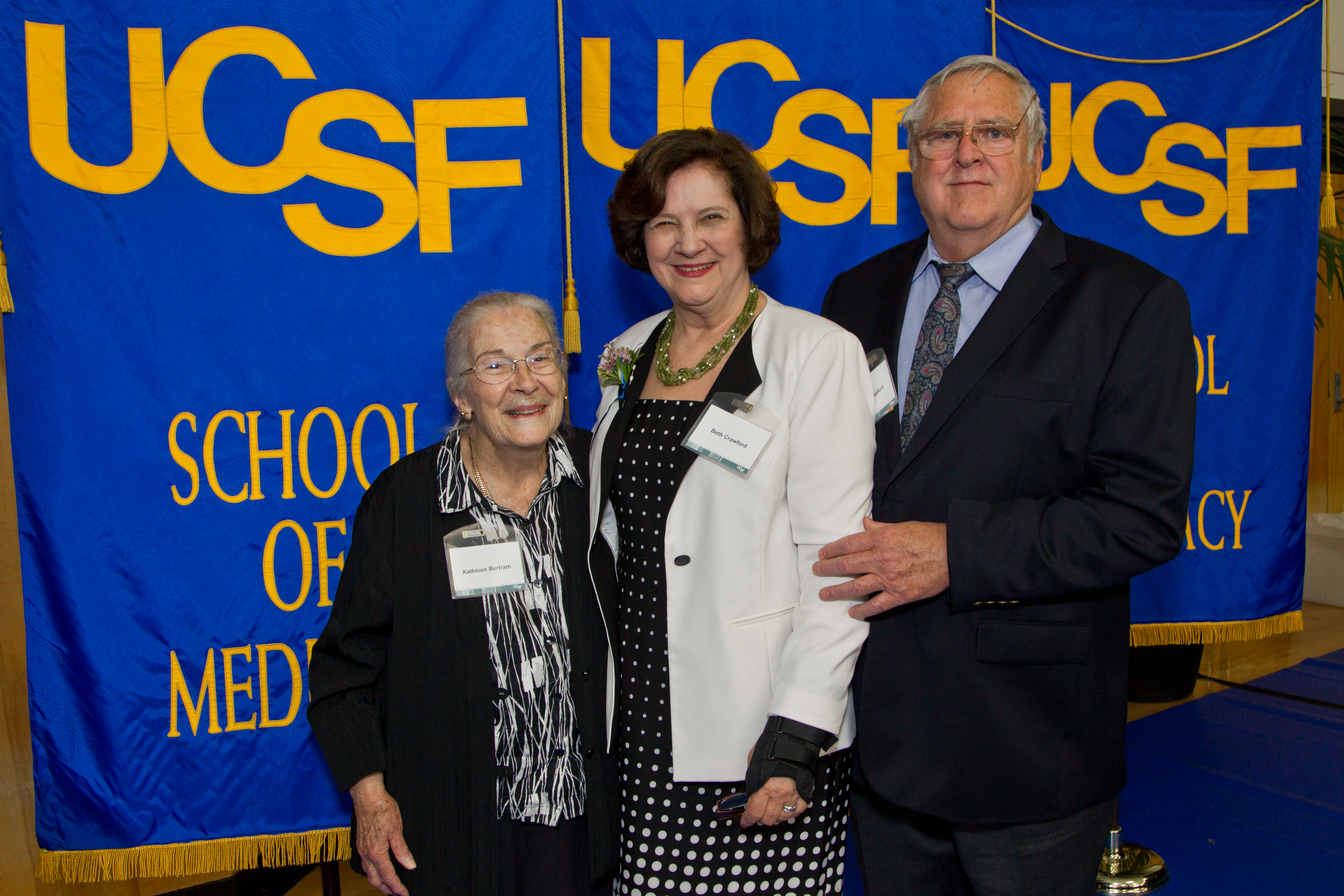 Beth Crawford, recipient of the Milton and Helen Pearl Award or Outstanding Service, stands with her mother, Kathleen Bertram, and her husband, David Crawford.