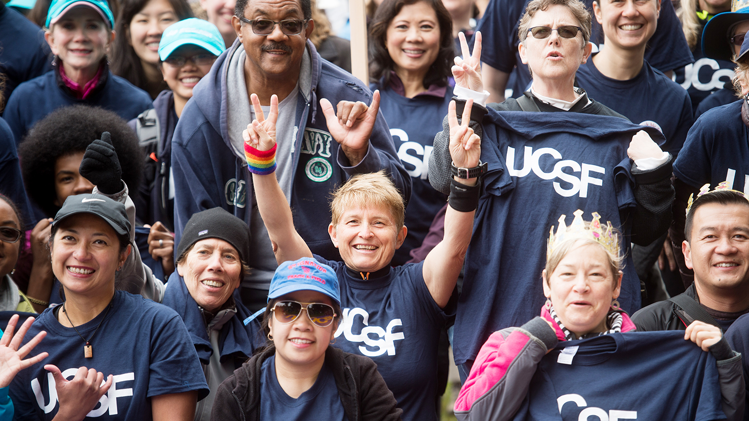 a group of people wear UCSF tshirts at the AIDS Walk SF