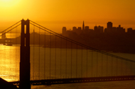 Golden Gate Bridge at sunrise with San Francisco in the backround.