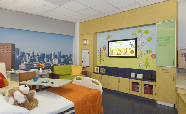 A mock up of an acute pediatrics room shows a multimedia wall.