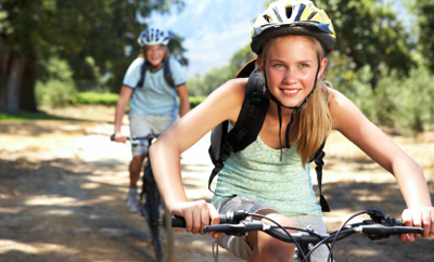 Stock image of teens riding bikes 