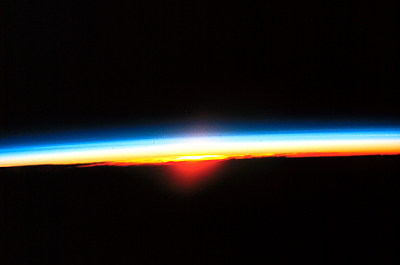 A rarely-seen view of a sunrise from outer space.