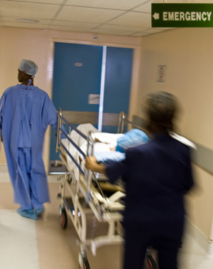Stock photo of medical professionals rushing patient to ER