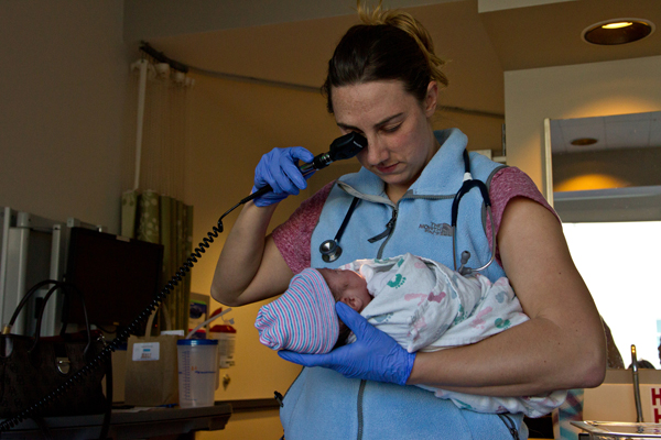 Pediatric resident Alison Kuchta performs routine tests for newborns on 6-hour-o