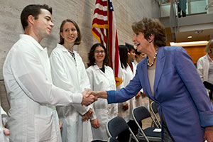 Democratic Leader Nancy Pelosi greets scientists at UCSF Mission Bay.