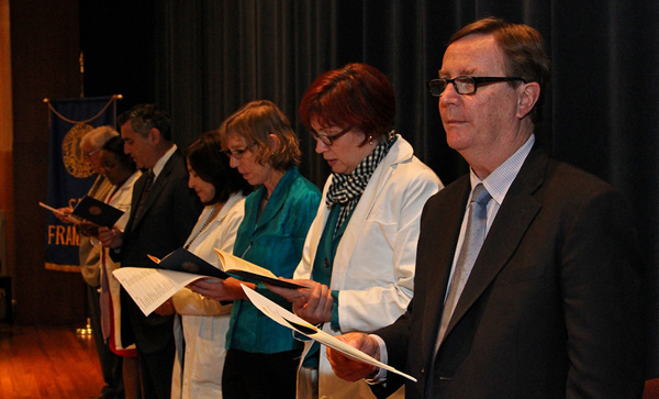 Medical Alumni Association join the students in reading the "Oath of Lasagna,"