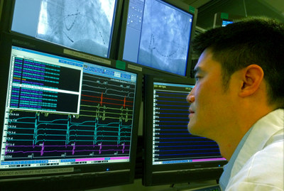 Zian Tseng, MD, reviews the electrical activity of a patient’s heart at the UCSF