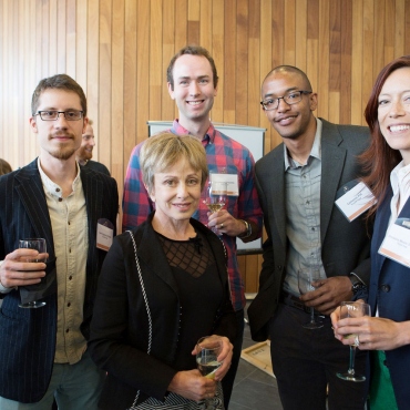 UCSF Discovery Fellows pose for a group photo with Harriet Heyman at a reception