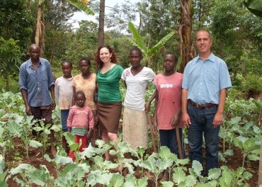 Kenyan farmers standing with researchers