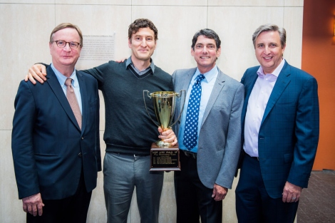 4 men pose with the UCSF AIDS Walk Trophy