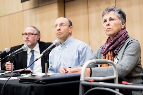 Brian Groves, Dan Lowenstein and Barbara French listen to a speaker during UCSF’s immigration town hall