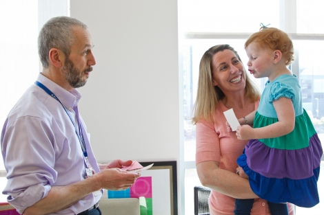 Saleh Adi talks with UCSF Benioff Children's Hospital San Francisco patient Kendall Layous and her mother, Shonda.