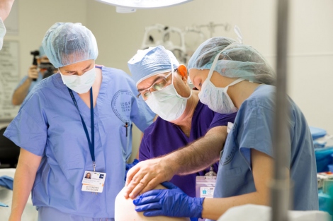 a doctor and two nurses in the operating room