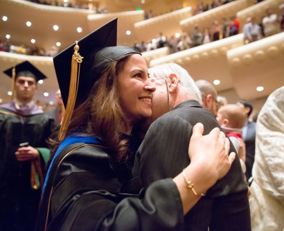 School of Medicine graduate hugs a loved one