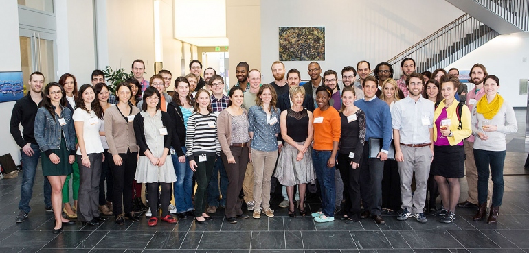 Members of the inaugural class of Discovery Fellows pose for a photo with Harriet Heyman.