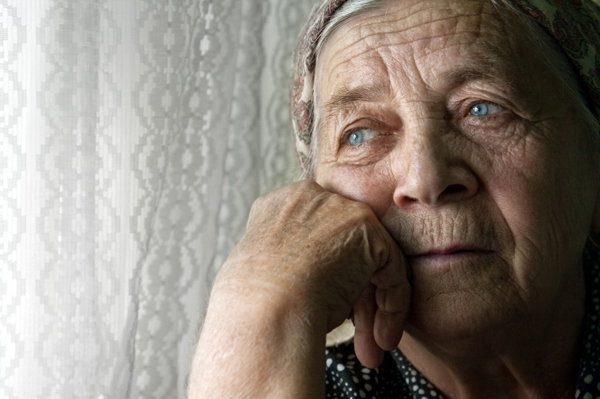 Elderly woman looking forlorn