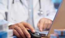 Stock image of doctor using computer