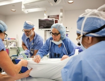 Nancy Ascher, MD, PhD, at work in the operating room