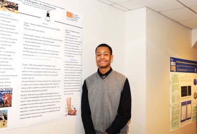 BHSI intern Mario Goins II poses for a photo with his poster ...