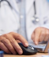 Stock image of doctor using computer