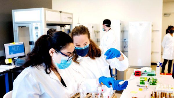 two female researchers work in a lab
