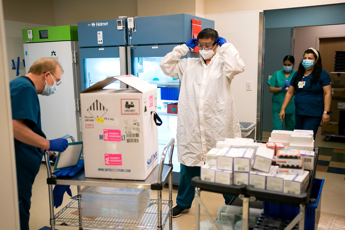 UCSFers prepare to unpack the Pfizer vaccine for distribution