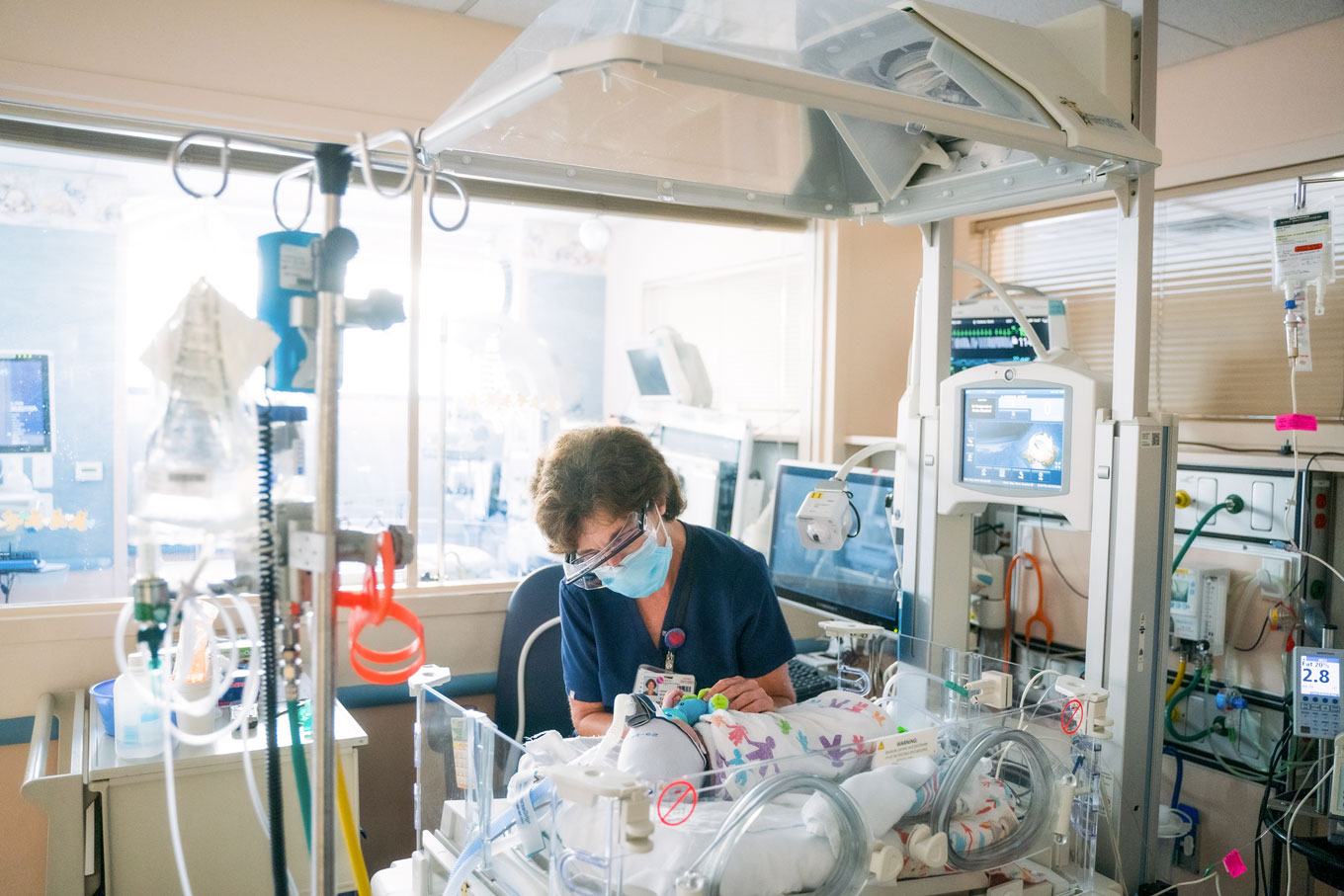 A nurse tends to a baby at the Benioff Children's Hospital Oakland Neonatal Intensive Care Unit