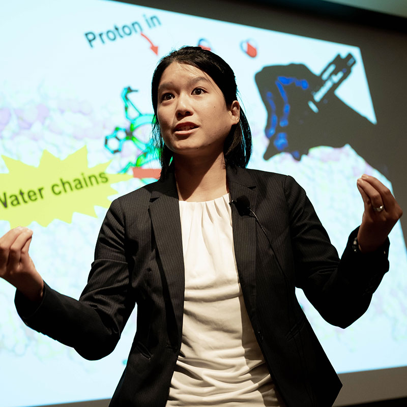 Postdoctoral student Huong Kratochvil presents research onstage
