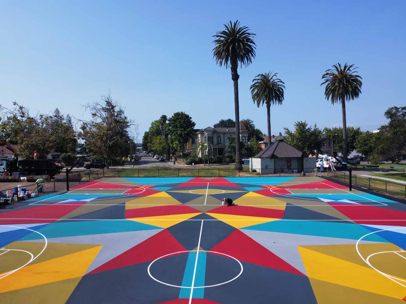 A colorful mural on the Lowell Park basketball courts in Oakland by Adia Millett.