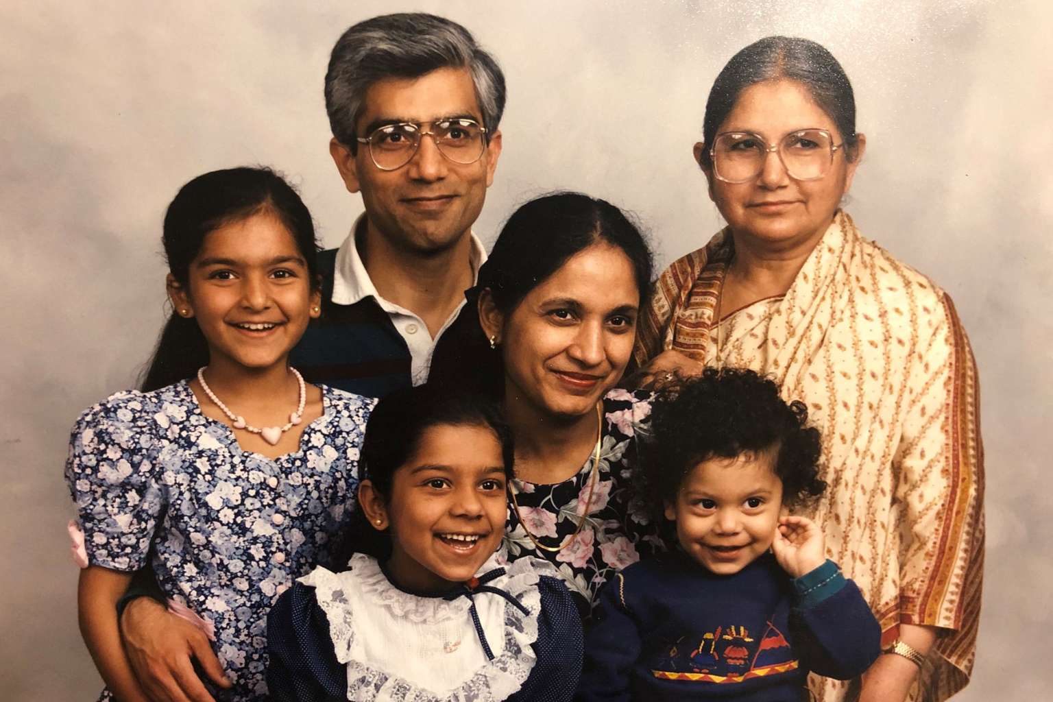 Indian family of six pose for a studio photo
