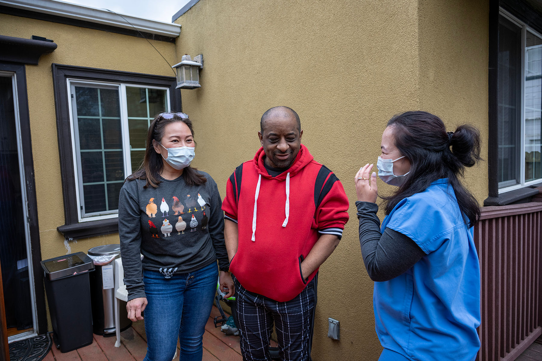 Patient Russell Hughes laughs and jokes with his in-home nurses.