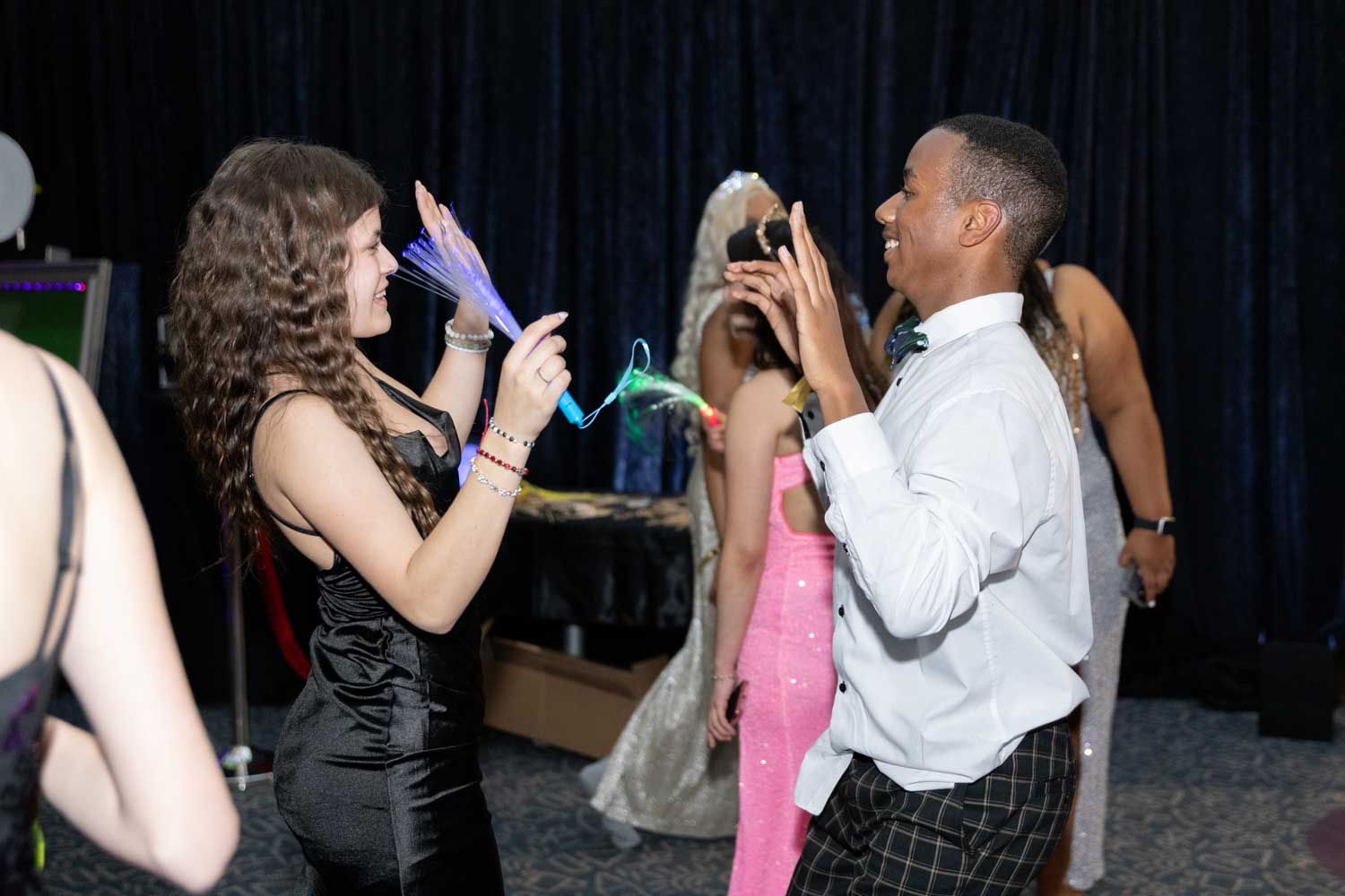 Teens dance happily at the U C S F Benioff Children's Hospital Oakland's prom event.