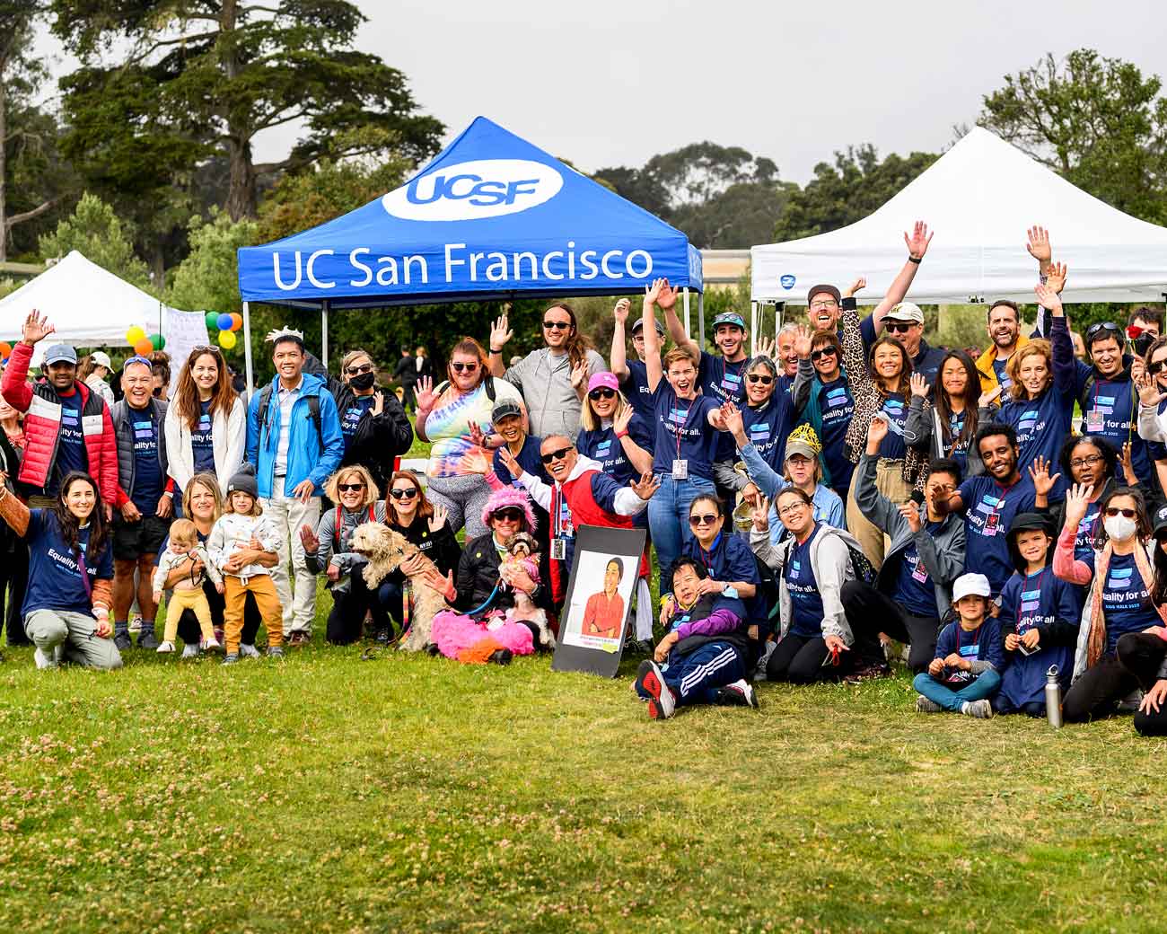 Participants at the 2022 U C S F AIDS walk pose for a large group photo at Golden Gate Park.