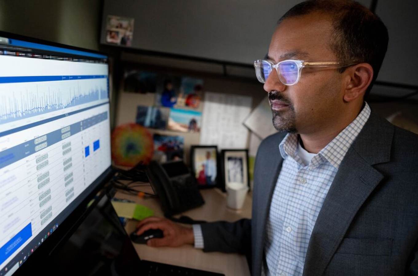 Vikram Rao looks at data on computer monitor.