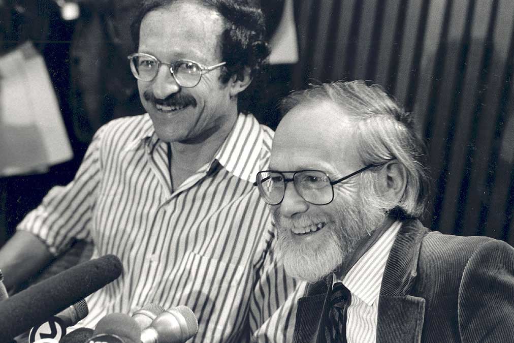 Harold Varmus and J. Michael Bishop talking at a Nobel Prize press conference.