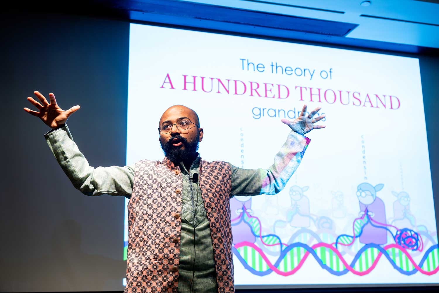 Postdoc Slam 2025 first place winner Atreya Dey delivers his talk on stage.