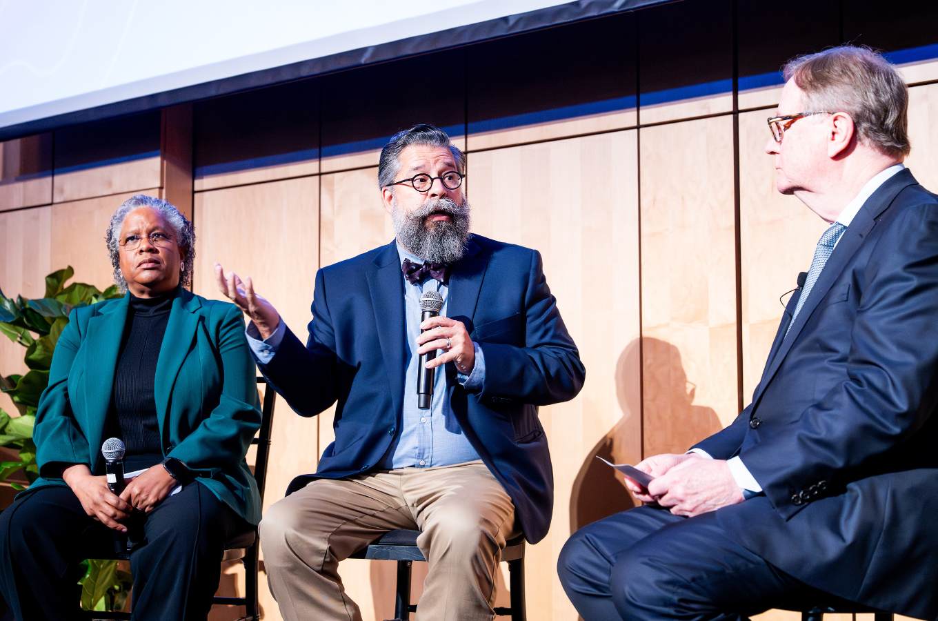 Chancellor Sam Hawgood onstage for a panel discussion with Nicquet Blake, PhD and Jon Davis Rordríguez, PhD, MD.