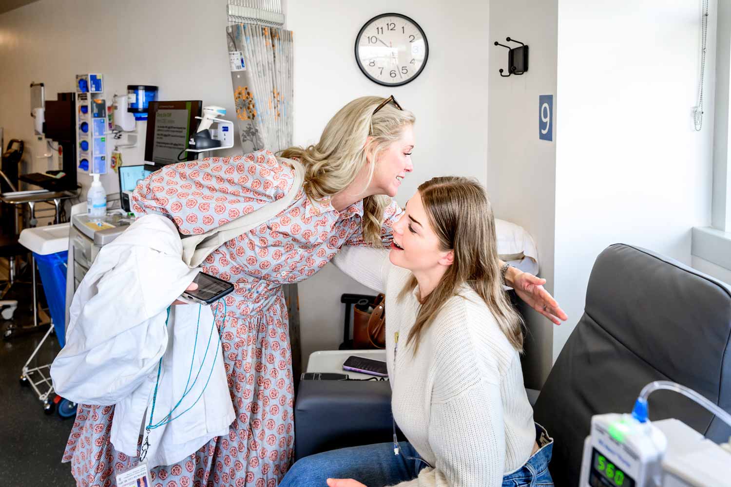 Dr. Katherine Van Loon hugs her patient Megan, a young woman who was diagnosed with colorectal cancer.
