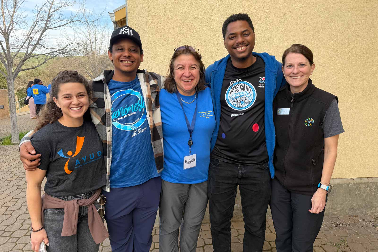 Marcela Arregui Reyes, one of the camp's organizers, poses for a photo with attendees and staff members.