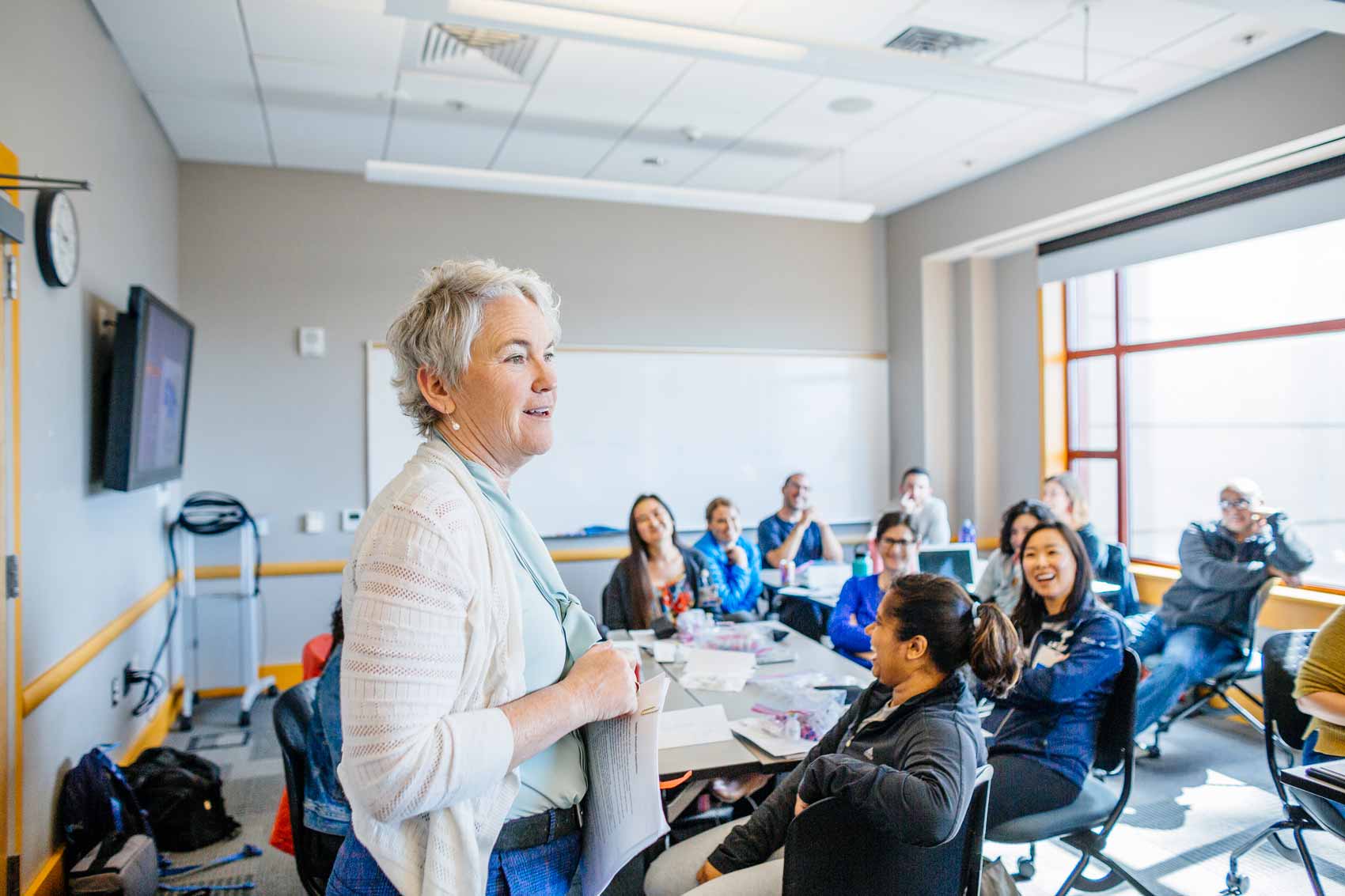 Maureen McGrath teaches a diabetes simualtion class to a group of adults.